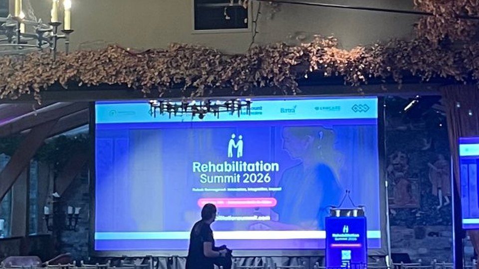 The main hall at the Rehabilitation Summit 2026, Barberstown Castle, with the summit screens on stage